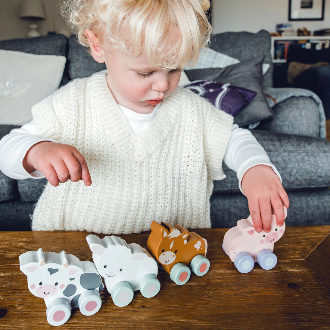 Wooden push along cow toy made from sustainable wood, eco-friendly toddler toy with wheels, safe and smooth design for ages 18m+