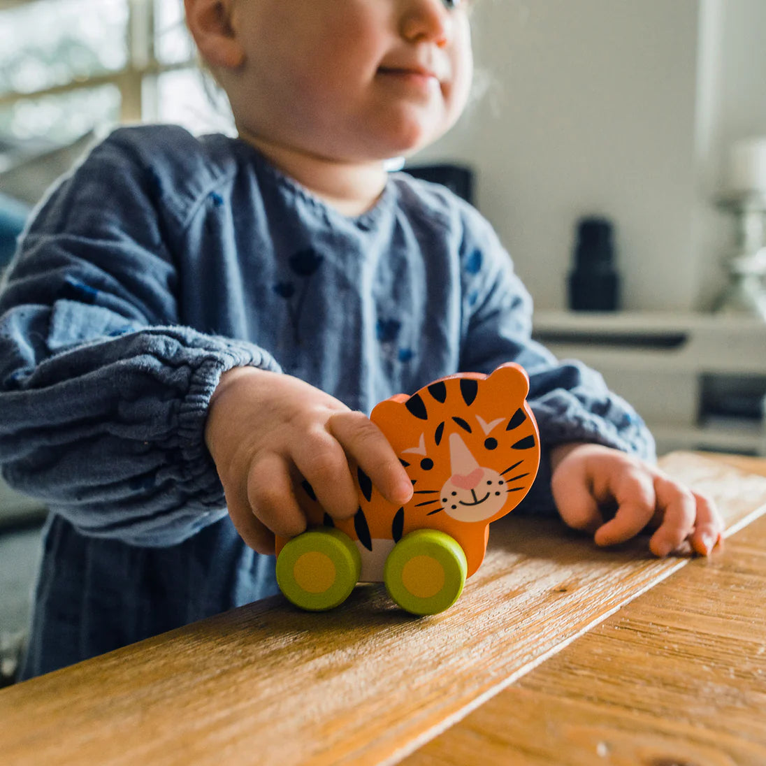 Wooden push along tiger toy made from FSC® sustainable wood, eco-friendly toy for toddlers aged 18m+, bright and safe design