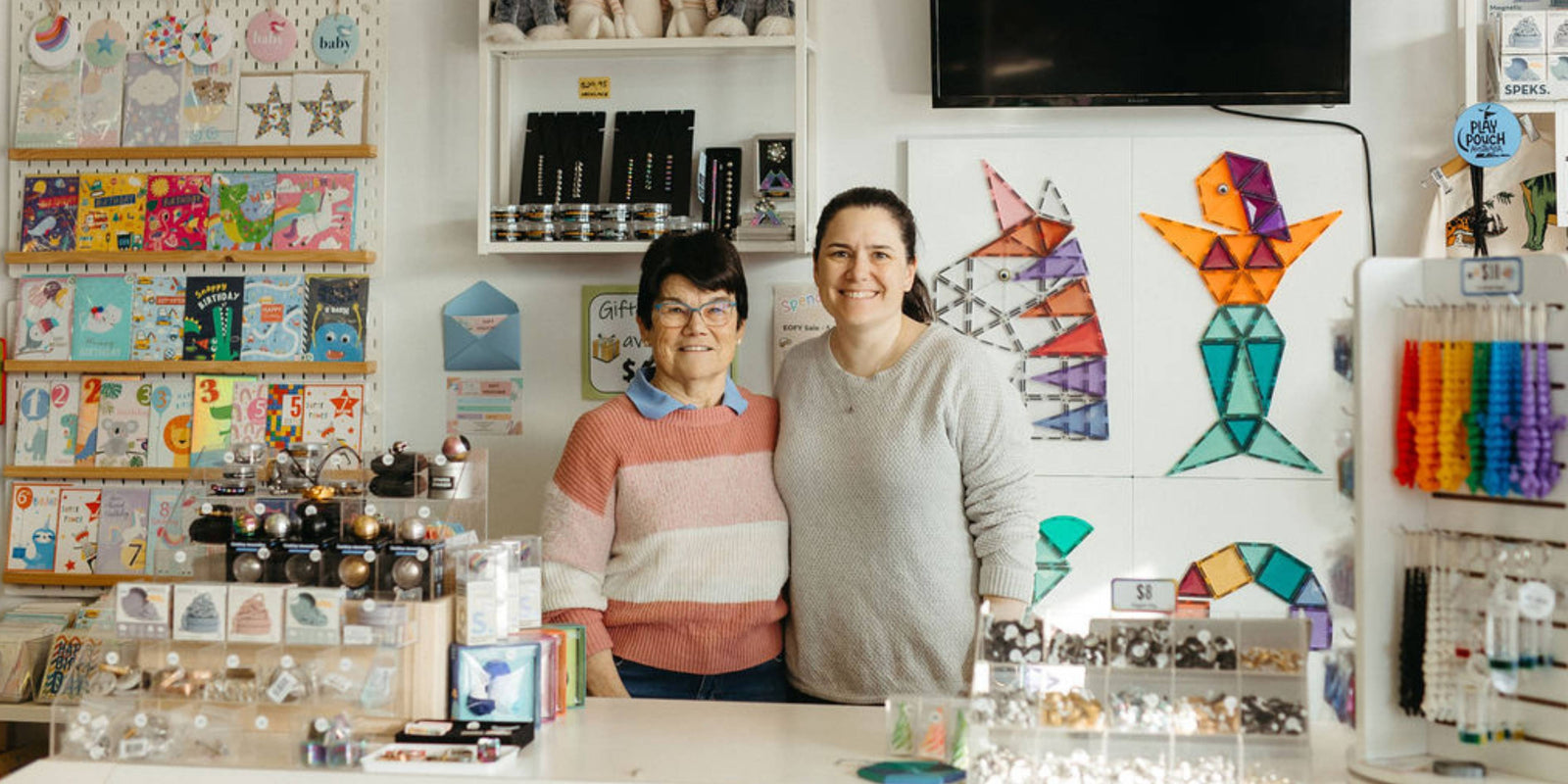 Lyn and Nikki co-owners of That's Cute standing behind the store counter