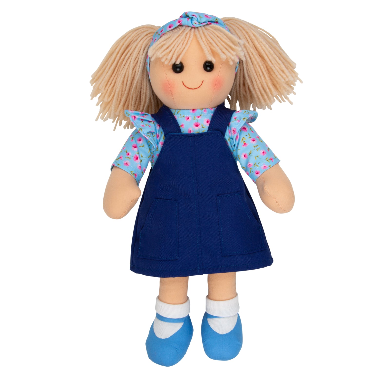 Hopscotch Collectables Soft Doll Carrie wearing a blue pinafore dress with floral top and headband, 35cm soft rag doll for children