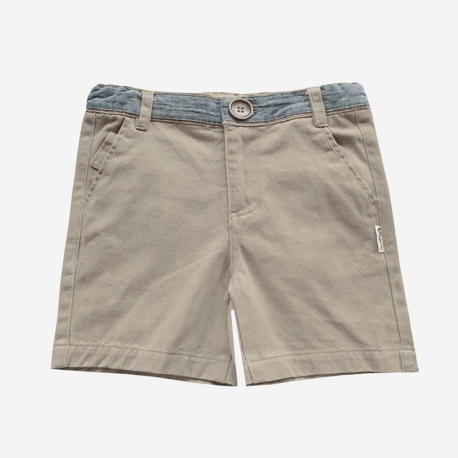The Love Henry Boys Oscar Shorts - Taupe are cotton shorts for boys featuring front pockets, a blue-gray waistband, and a button closure, shown on a plain white background.
